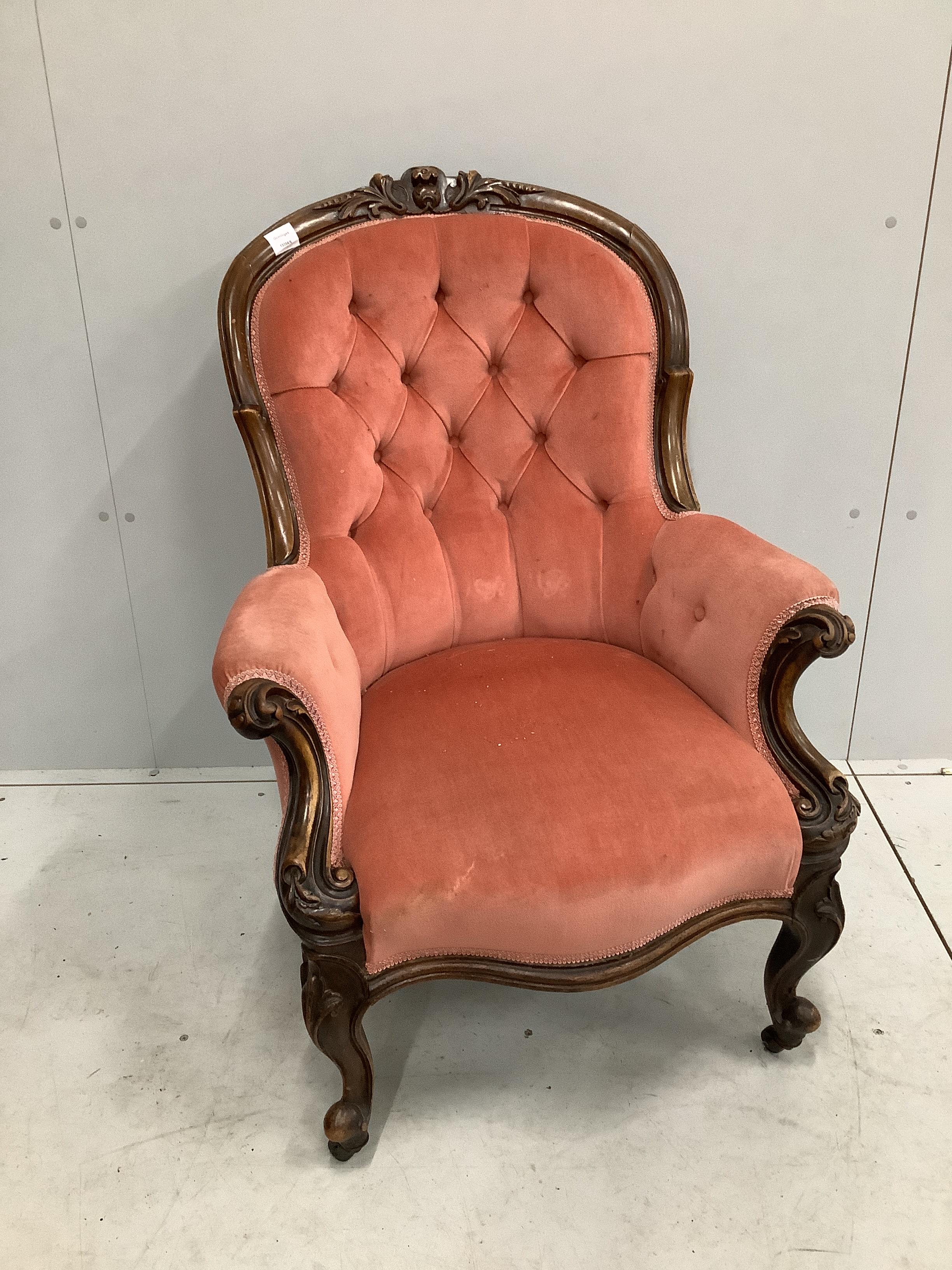 A Victorian walnut spoon back armchair, width 70cm, depth 72cm, height 98cm